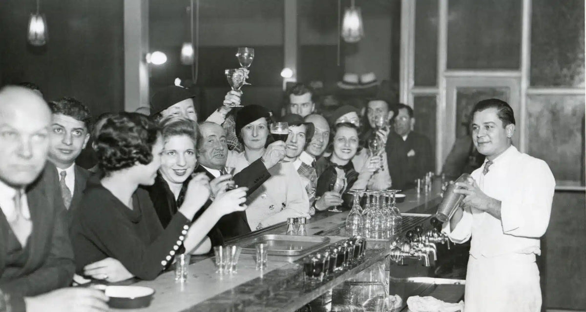 Patrons raise a toast at a Prohibition-era bar, December 1933